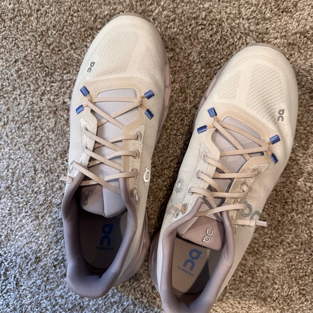 On Running Cream and Blue Athletic Shoes